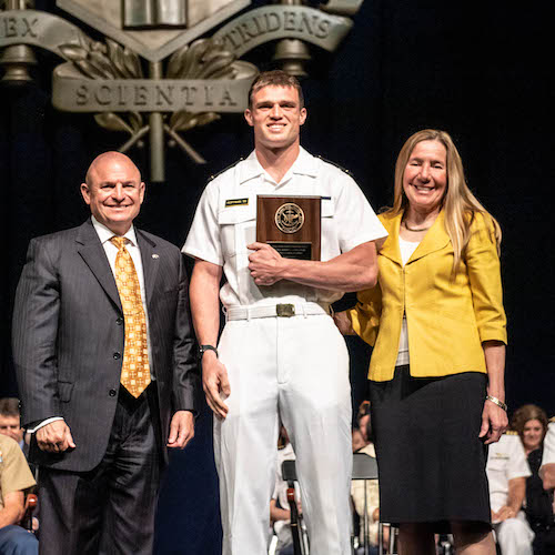 CAPT (Ret) Susan Chiaravalle and USNA Provost Dr. Andrew T. Phillips presented the 2023 ADM Robert L.J. Long Award to MIDN 1/C Ryan Hoffman in May 2023.