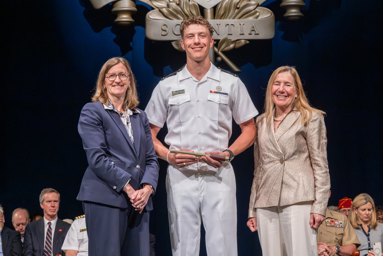  U.S. Naval Academy Provost Samara L. Firebaugh (left) and CAPT (Ret) Susan Chiaravalle presented then-MIDN 1/C Edward Konjoyan with the 2025 Admiral L. J. Long Award on 21 May 2026. (USNA)